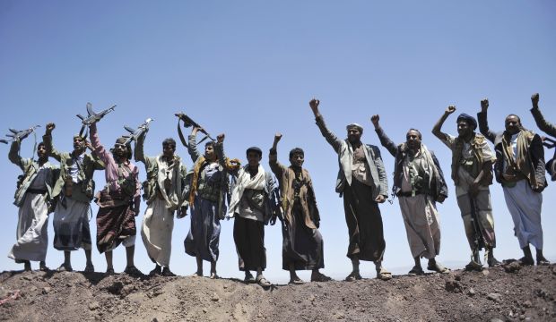 Houthi rebels chant slogans at the compound of the army's First Armored Division, after they took it over, in Sana'a, Yemen, on September 22, 2014. (AP Photo/Hani Mohammed)
