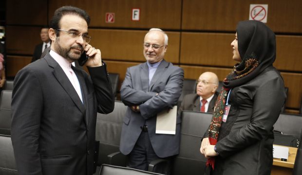 Iran's envoy to the International Atomic Energy Agency (IAEA) Reza Najafi gives a phone call upon arrival at a IAEA Board of Governors' meeting at the International Center in Vienna on September 17, 2014 (AFP PHOTO/DIETER NAGL)