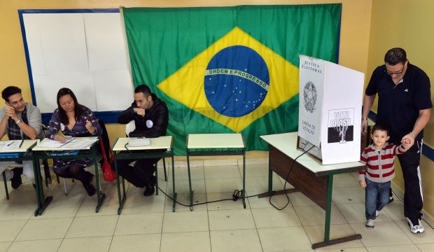 A man leaves the polling booth  after casting his vote at a school in São Bernardo do Campo, south of São Paulo, Brazil, on October 5, 2014. (AFP Photo/Nelson Almeida)
