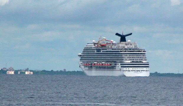 The cruise ship Carnival Magic passes near Cozumel, Mexico, on October 17, 2014. (AP Photo/Angel Castellanos)