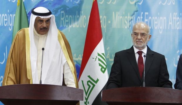 Kuwait's Foreign Minister Sabah Al-Khalid Al Sabah speaks during a news conference with his Iraqi counterpart Ibrahim Al-Jaafari (R) in Baghdad, Iraq, on October 19, 2014. (Reuters/Ahmed Saad)