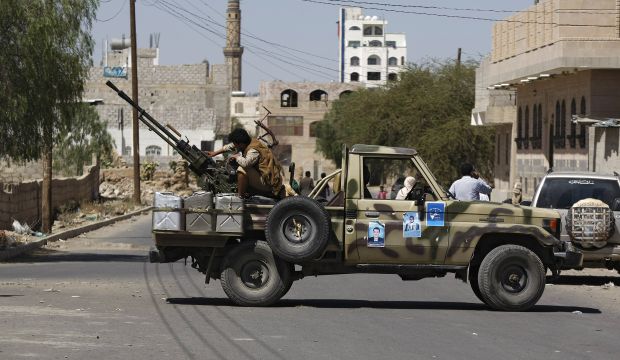 A Houthi Shi'ite rebel mans a machine gun mounted on a military truck in Sana'a, Yemen, on October 20, 2014. (AP Photo/Hani Mohammed)