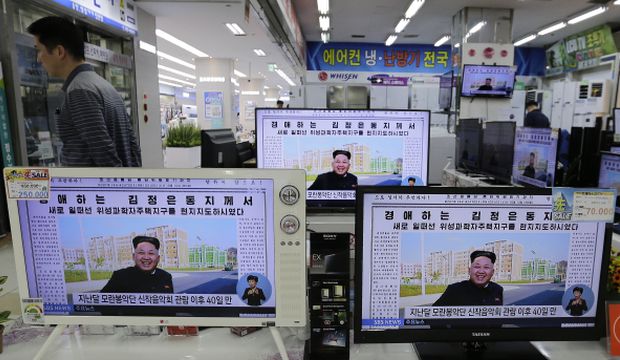 Monitors display a news program at an electronics shop in Seoul, South Korea, showing a local newspaper with a photo of North Korean leader Kim Jong-un, on October 14, 2014. (AP Photo/Ahn Young-joon)