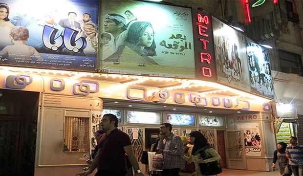 People walk past the Metro cinema in Downtown Cairo, Egypt, on October 16, 2012. (Reuters/Mohamed Abd El Ghany)