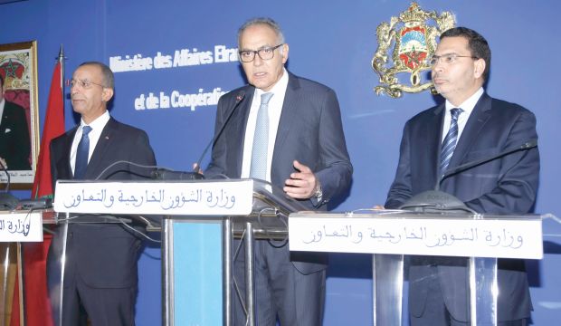 Moroccan Foreign Minister Salaheddine Mezouar (center) speaks at a press conference in Rabat on 29/10/2014. (Asharq Al-Awsat/Mustafa Habis) 