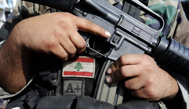 A Lebanese army soldier holds his weapon after being deployed to tighten security, following clashes between Lebanese soldiers and Islamist gunmen in Tripoli, northern Lebanon, on October 27, 2014. (Reuters/Mohamed Azakir)
