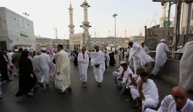 Muslim pilgrims gather outside the Grand Mosque, a day before Muslims' annual pilgrimage, known as the Hajj, in the Muslim holy city of Mecca, Saudi Arabia, on October 1, 2014. (AP Photo/Khalid Mohammed)