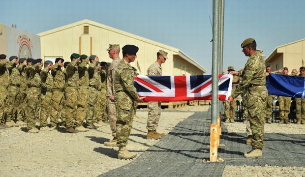 UK Armed Forces take part in a ceremony marking the end of British operations in Afghanistan, at Camp Bastion, Helmand Province, on October 26, 2014. (AP Photo/British Defence Imagery, Sergeant Obi Igbo, RLC)