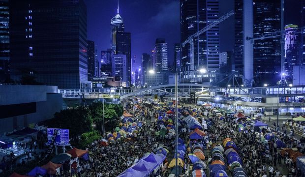 Pro-democracy protesters gather at the main protest camp in the Admiralty district of Hong Kong on October 24, 2014. (AFP Photo/Philippe Lopez)
