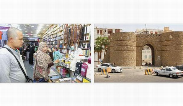 Tourists buying souvenirs in one of Jeddah's souqs. (Asharq Al-Awsat)