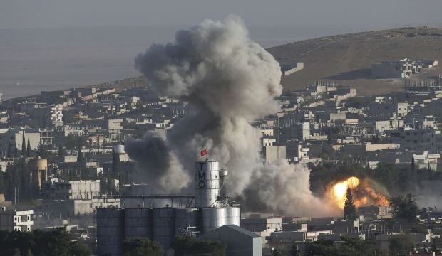 Smoke rises after an US-led air strike in the Syrian town of Kobani on October 10, 2014. (Reuters/Umit Bektas) 