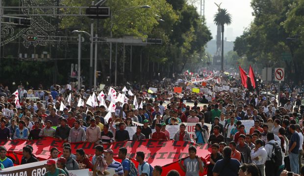 Activists march in support of 43 missing students, who vanished in the city of Iguala, in downtown Mexico City, Mexico, on October 8, 2014. (EPA/Jose Mendez)
