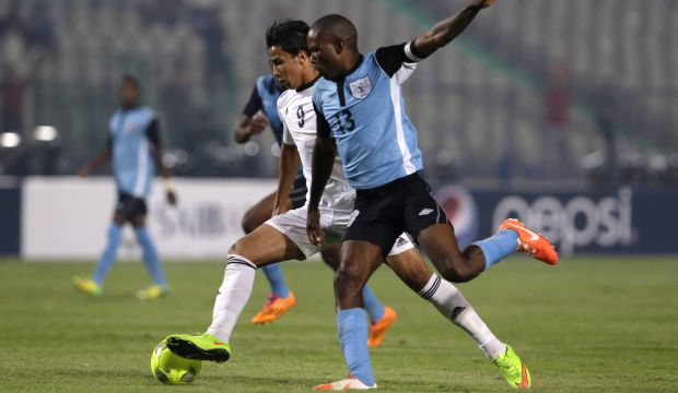 Egypt's Amr Gamal (L) scores his side's opening goal against Botswana during their African Nations Cup qualifying match at  Cairo International Stadium, Egypt, on October 15, 2014. (AP Photo/Hassan Ammar)