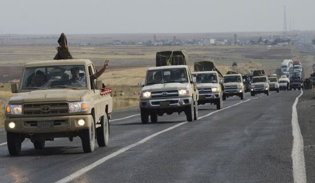 A convoy of peshmerga vehicles makes its way to the Turkish-Syrian border, near the town of Kiziltepe, in the southeastern Mardin province October 29, 2014. (Reuters)