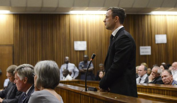 Oscar Pistorius stands in the dock as his sentence is delivered at the North Gauteng High Court in Pretoria on October 21, 2014. (Reuters/Herman Verwey/Pool)