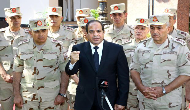 Egypt's President Abdel-Fattah El-Sisi addresses journalists following an emergency meeting of the Supreme Council of the Armed Forces in Cairo on October 25, 2014. (AFP)