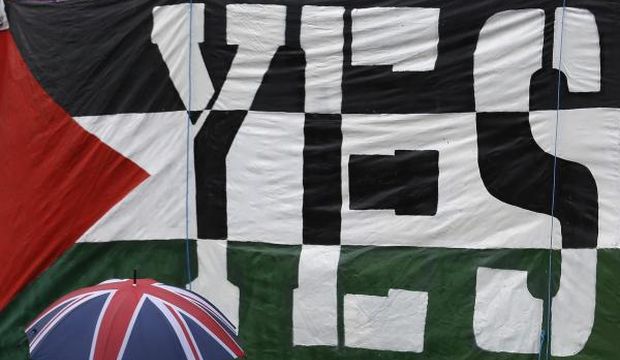 Pro-Palestine demonstrators protest outside the Houses of Parliament as MPs debate the recognition of Palestine as a state, in London, United Kingdom, on October 13, 2014. (Reuters/Luke MacGregor)