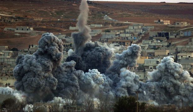 An explosion following an airstrike is seen in the Syrian town of Kobani from the Turkish border, on November 2, 2014. (Reuters/Yannis Behrakis)