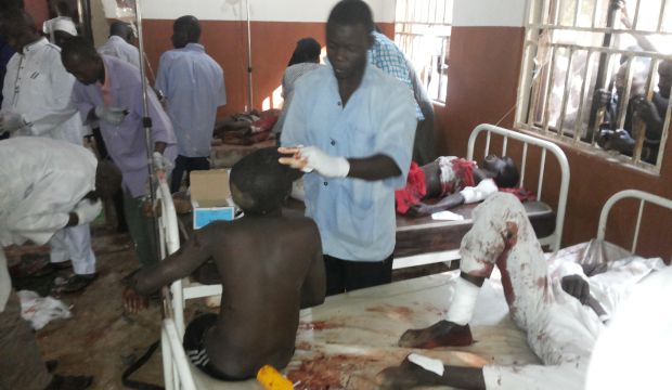 People are treated at the General hospital in Potiskum, Nigeria, on November 10, 2014, following a suicide bomb attack at Government Science Technical College Potiskum. (AP Photo/Adamu Adamu)