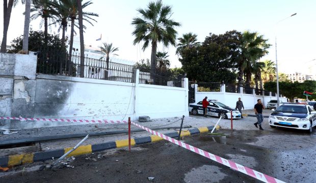 Libyan security forces seal off the compound of the Egyptian embassy in Tripoli on November 13, 2014, after it was targeted by a car bomb. (AFP PHOTO/MAHMUD TURKIA)