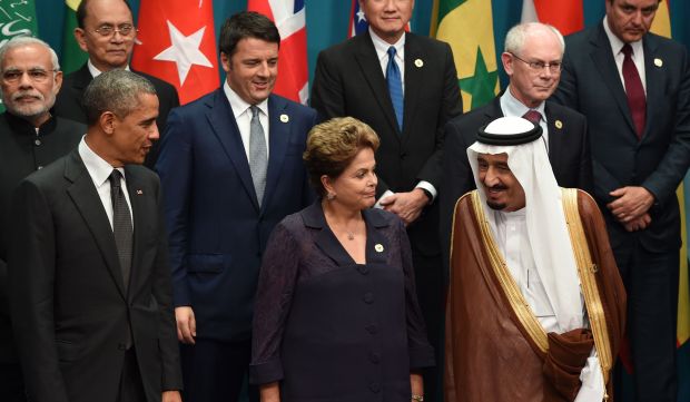 Saudi Arabia's Crown Prince Salman Bin Abdulaziz (front R) stands with Brazil's President Dilma Rousseff (front C) and US President Barack Obama (front L) as they are joined by heads of states and international organizations to pose for a photo in Brisbane, Australia, on November 15, 2014. (AFP Photo/Saeed Khan)