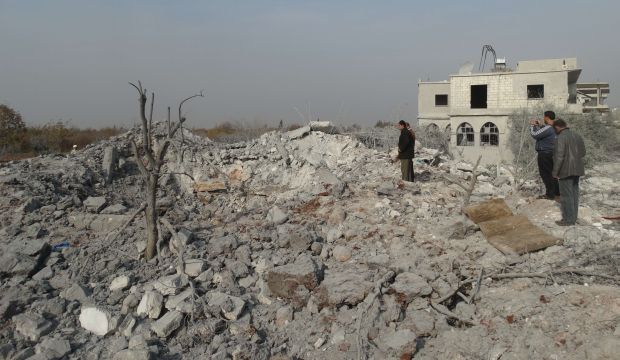 Syrians inspect the damage following a reported US-led coalition air strike in the town of Harem in the northwestern province of Idlib, bordering Turkey, on November 19, 2014. (AFP PHOTO/MOHAMAD ZEEN)