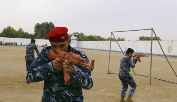 Sunni tribesmen take part in military training, as they prepare to fight against militants of the Islamic State of Iraq and Syria (ISIS) on the outskirts of Ramadi, west of Baghdad, on November 16, 2014. (Reuters/Ali Al-Mashhadani)