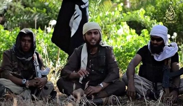 In this still taken from an Islamic State of Iraq and Syria (ISIS) video, an Islamist fighter (C), identified as Abu Muthana Al-Yemeni from Britain, speaks from an unknown location. (Reuters/Reuters TV)