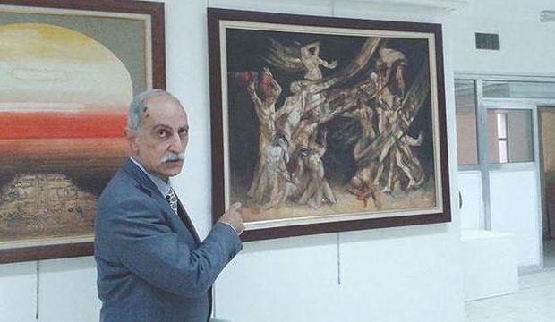Salam Atta Sabri shows off the exhibition hall filled with the works of Iraq's modern artists. (Asharq Al-Awsat)