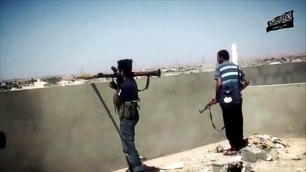 An image taken from a video by the official media outlet of Ansar Al-Sharia allegedly shows their militants during a battle in Benghazi. (AFP Photo/al-Raya Media Foundation/HO)