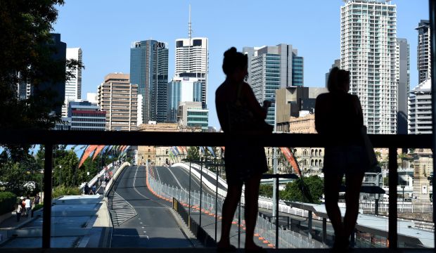 Tourists look down on a cordoned off bridge near the Brisbane Convention and Exhibitions Center, in Brisbane, Australia, where world leaders will meet for the G20 summit on November 15–16, 2014. (EPA/Lukas Coch)