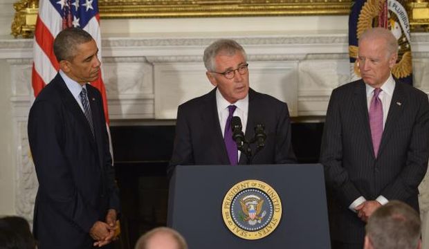 US President Barack Obama and Vice President Joe Biden listen as Defense Secretary Chuck Hagel (C) speaks during a press conference to announce his resignation, at the White House, Washington, DC, on November 24, 2014 (AFP Photo)