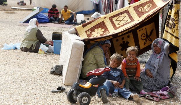 Kurdish refugees from the Syrian town of Kobani take shelter in a camp in the Turkish town of Suruç, on October 14, 2014. (Reuters/Umit Bektas)