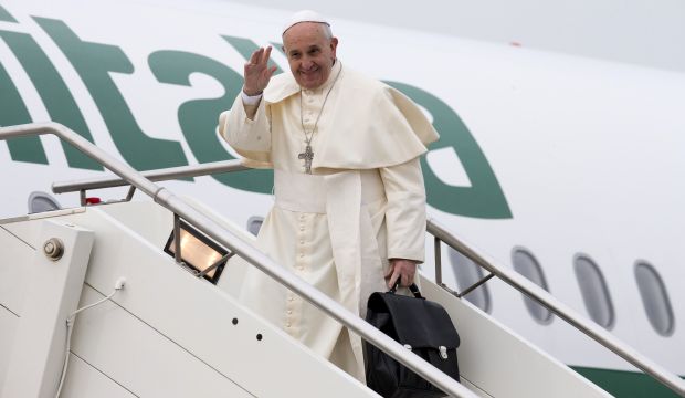 Pope Francis embarks a plane leaving for Turkey at Rome's Fiumicino international airport, on November 28, 2014. (AP Photo/Alessandra Tarantino)