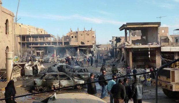 The aftermath of Syrian government airstrikes on a street in Raqqa on November 25, 2014. (AP Photo/Raqqa Is Being Slaughtered Silently)