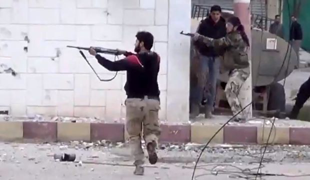 Free Syrian Army fighters fire at Syrian government soldiers during a fierce firefight in Dera'a, Syria, in March 2013. (AP Photo/Shaam News Network via AP video, File)