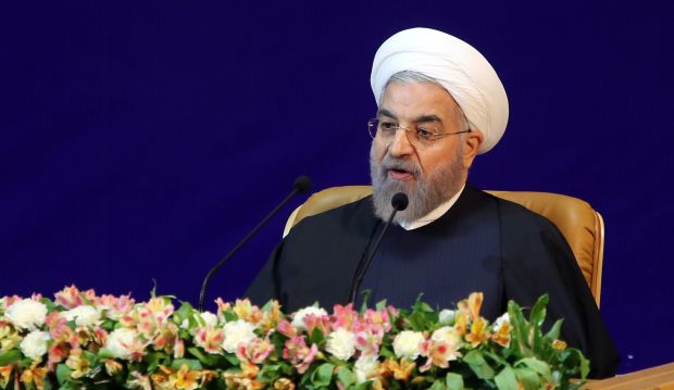 Iranian President Hassan Rouhani delivers a speech during the opening session of a two-day conference on combating extremism in Tehran on December 9, 2014. (AFP PHOTO/ATTA KENARE)