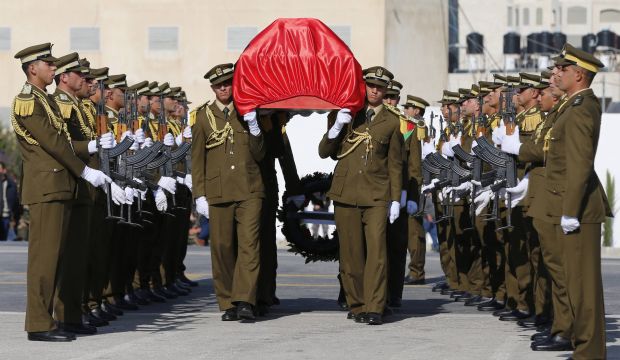 Palestinian honor guards carry the coffin of Palestinian minister Ziad Abu Ein during his funeral in the West Bank city of Ramallah, on December 11, 2014. (REUTERS/Ammar Awad)