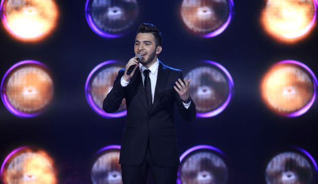 Syrian singer Hazem Sharif, 21, from Aleppo in northern Syria, performs on "Arab Idol," broadcast by MBC Arabic satellite channel in Zouk Mosbeh neighborhood, north of Beirut, December 13, 2014. (AP Photo/Bilal Hussein)