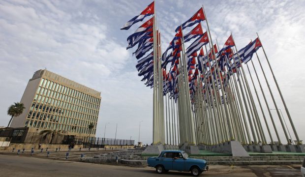 A car drives past the building of the the US trade mission in Cuba in Havana, on September 12, 2013. (REUTERS/Desmond Boylan/Files)