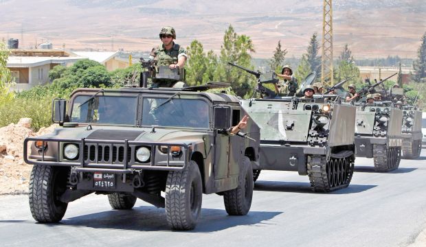 Lebanese army reinforcements arrive at an area on the outskirts of Arsal, in August 2014 (AP Photo/Bilal Hussein, File)