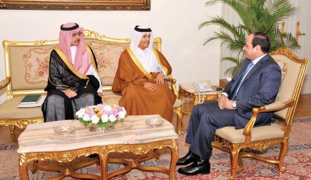 Egyptian President Abdel-Fattah El-Sisi (R) receives Qatari envoy Sheikh Mohammed Bin Abdul Rahman Al Thani and the head of the Saudi Royal Court  Khalid Al-Tuwaijiri in Cairo on December 21, 2014 (Egyptian presidency)
