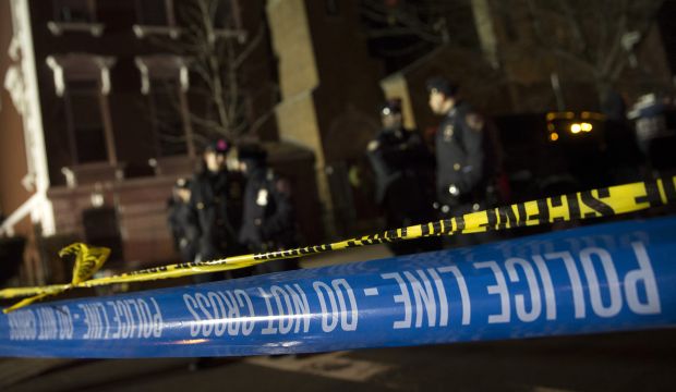Police guard the scene where two NYPD officers were shot, on December 20, 2014, in New York. (AP Photo/John Minchillo)