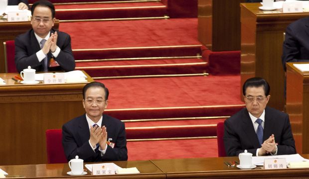 Ling Jihua (top L), a loyal aide and confidante to President Hu Jintao, (bottom R), sits behind Premier Wen Jiabao, (bottom L), and Hu as they attend a plenary session of the National People's Congress at the Great Hall of the People in Beijing, on March 11, 2012 (AP Photo/Andy Wong, File)