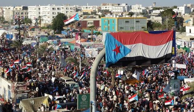 Yemeni protesters wave flags of the former People’s Democratic Republic of Yemen and march through the streets during a demonstration demanding renewed independence in the southern city of Aden, on November 30, 2014. (AFP Photo/Stringer)