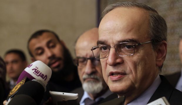 Hadi Al-Bahra, the head of the Syrian National Coalition, the country's main political opposition group, speaks during a press conference following his meeting with Arab League Secretary-General Nabil Elaraby at the league's headquarters in Cairo, Egypt, on Saturday, December 27, 2014. (AP Photo/Amr Nabil)