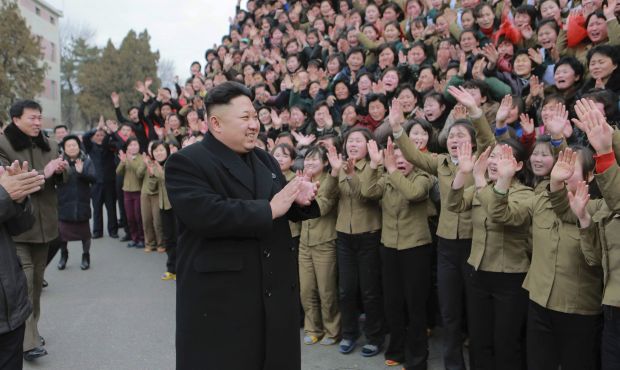 North Korean leader Kim Jong Un (C) smiles as he gives field guidance at the Kim Jong Suk Pyongyang Textile Mill in this undated photo released by North Korea's Korean Central News Agency (KCNA) in Pyongyang December 20, 2014.  (Reuters)