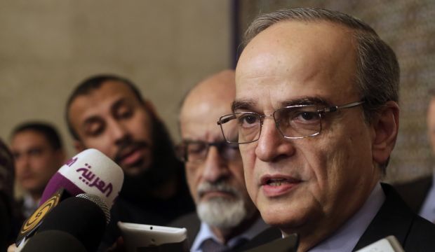Hadi Al-Bahra, the head of the Syrian National Coalition, speaks during a press conference following a meeting with Arab League Secretary-General Nabil Elaraby in Cairo, Egypt, on December 27, 2014. (AP Photo/Amr Nabil)