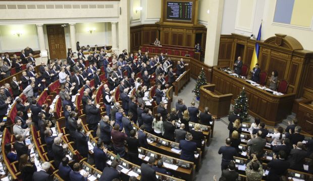 Parliamentary deputies applaud after a renouncing of Ukraine's "non-aligned" status during a session of a parliament in Kiev, December 23, 2014. (Reuters/Alex Kuzmin)