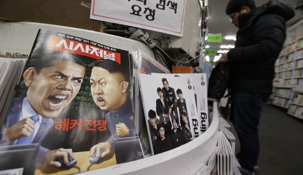 A magazine with cartoons of U.S. President Barack Obama (L) and North Korean leader Kim Jong Un (R) is displayed at a book store in Seoul, South Korea, on January 3, 2015..(AP Photo/Ahn Young-joon)